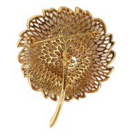 Monet Gold Tone Openwork Floral Brooch